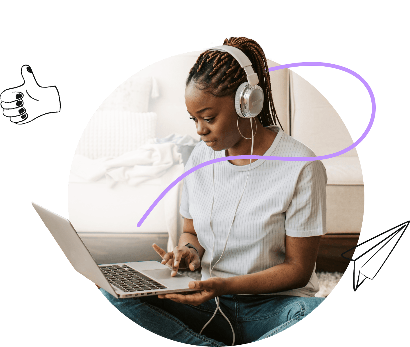 A woman in headphones working on a laptop